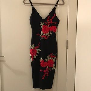 Black cocktail dress with floral embroidery